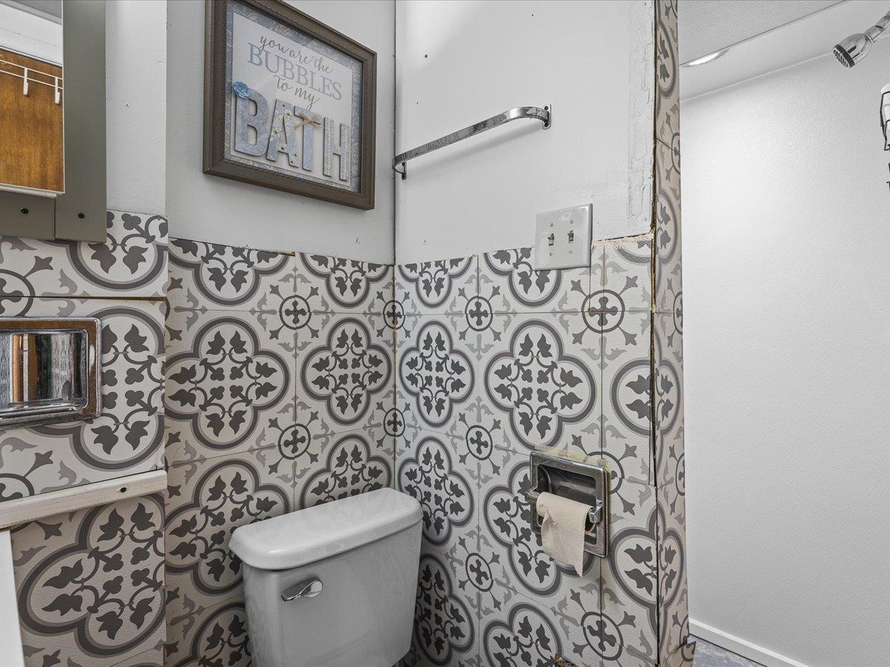 3215 Rural Street Rockford, IL 61107 - Photo 20 of 25 a white toilet sitting next to a bathroom sink