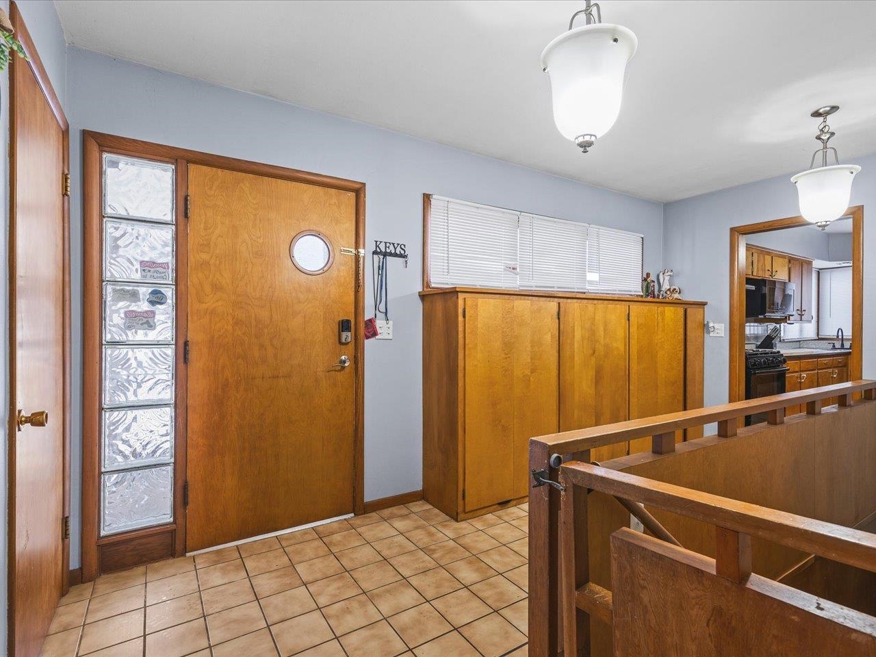 3215 Rural Street Rockford, IL 61107 - Photo 6 of 25 a view of an empty room with wooden floor and a window