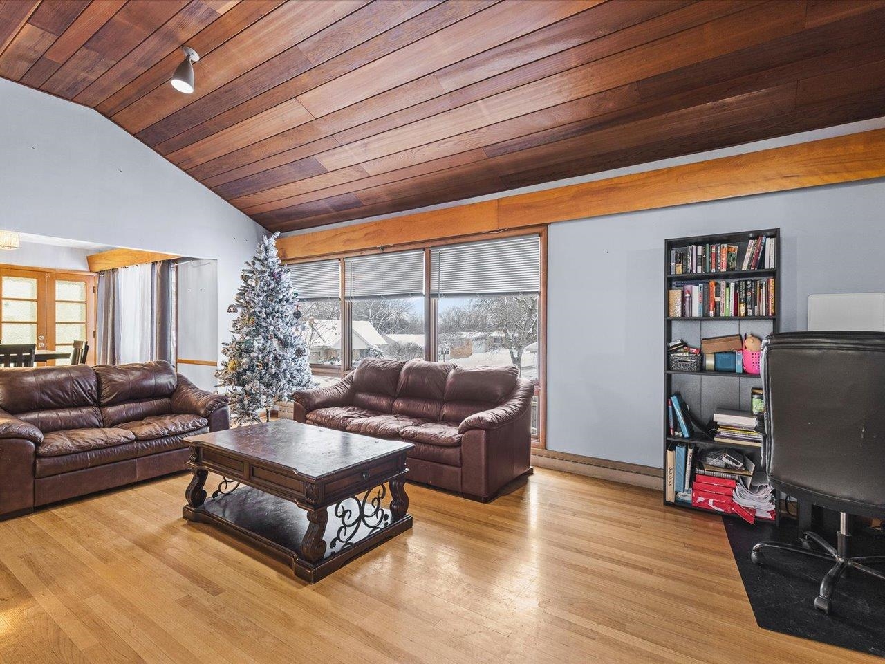 3215 Rural Street Rockford, IL 61107 - Photo 7 of 25 a living room with furniture a wooden floor and a large window