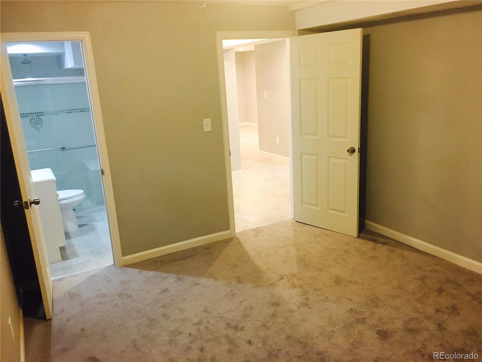 5542 Scranton Street Denver, CO 80239 - Photo 10 of 16 an empty room with a bathroom