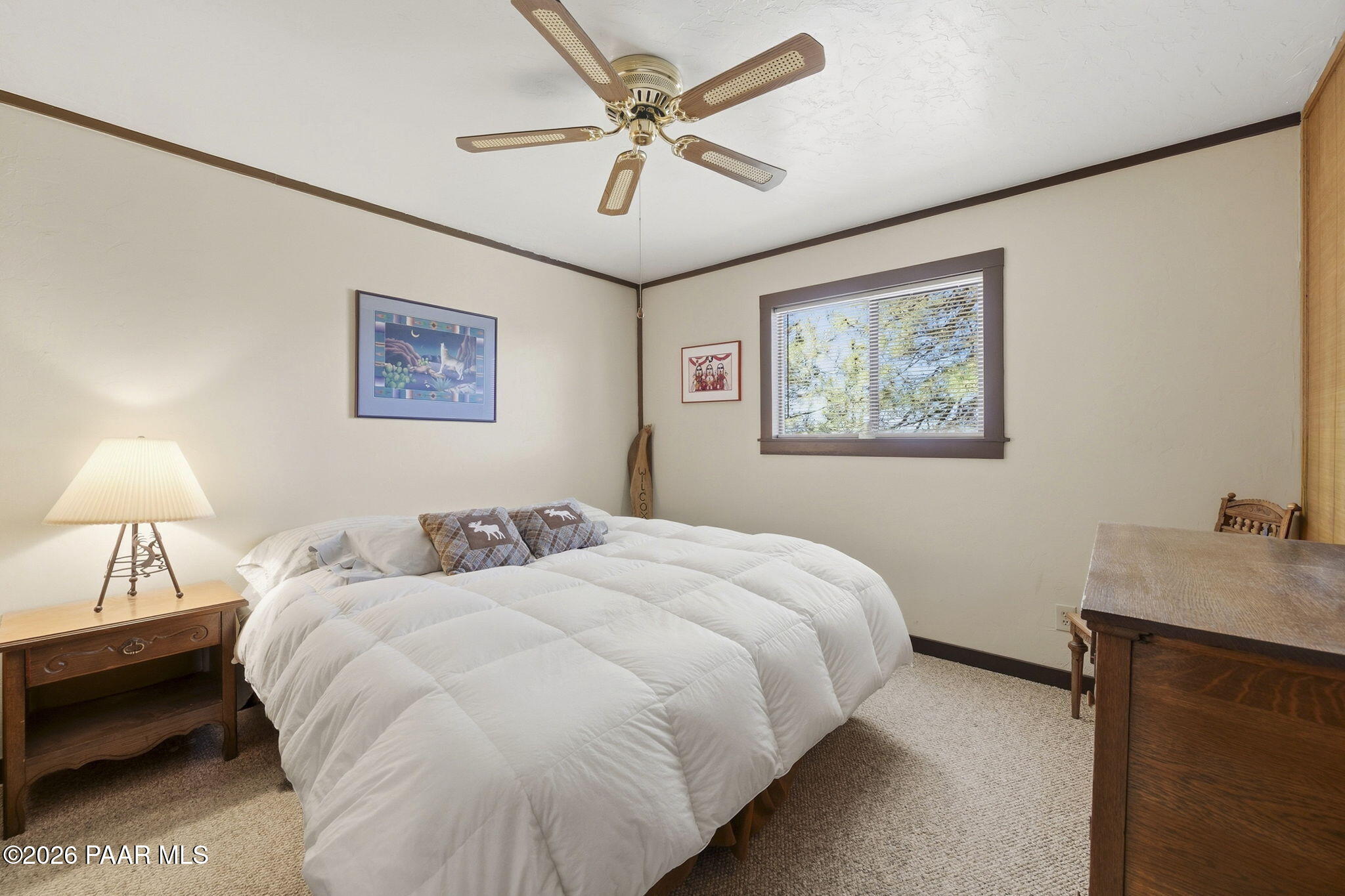 7251 South Big Bug Mesa Road Mayer, AZ 86333 - Photo 24 of 55 a bedroom with a bed and a chandelier