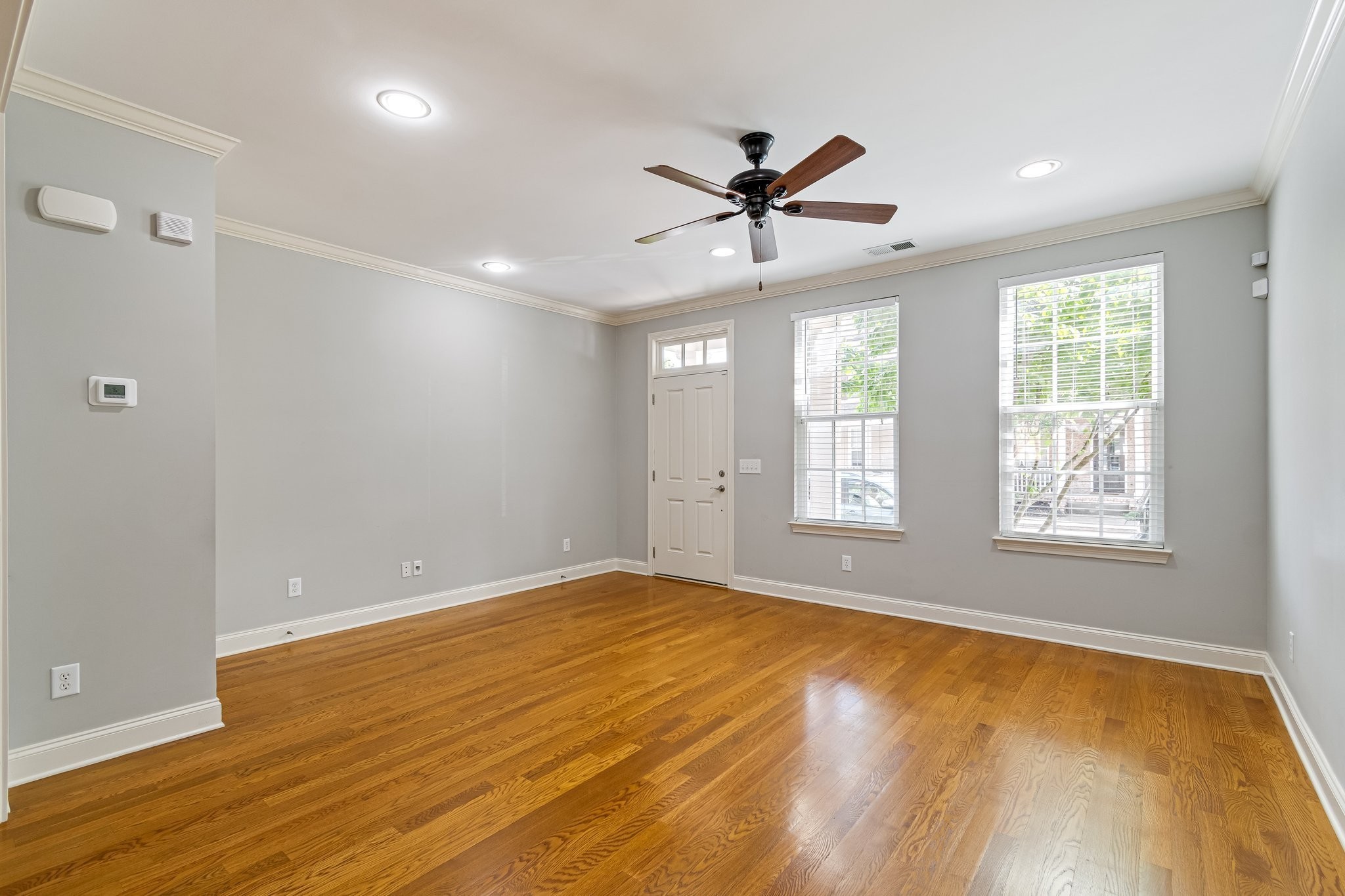 318 Byron Way Franklin, TN 37064 - Photo 11 of 53 a view of empty room with wooden floor and fan