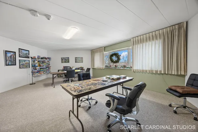 a view of a livingroom with furniture and a table