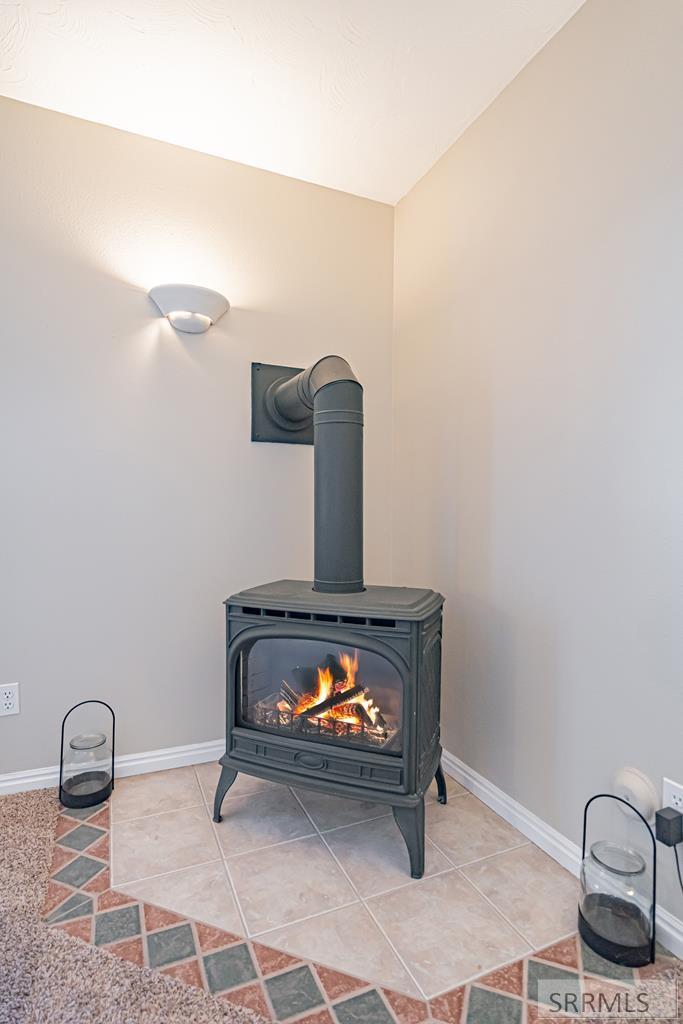 7121 South Culebra Rio Circle Idaho Falls, ID 83406 - Photo 49 of 90 Basement Family Room Fireplace
