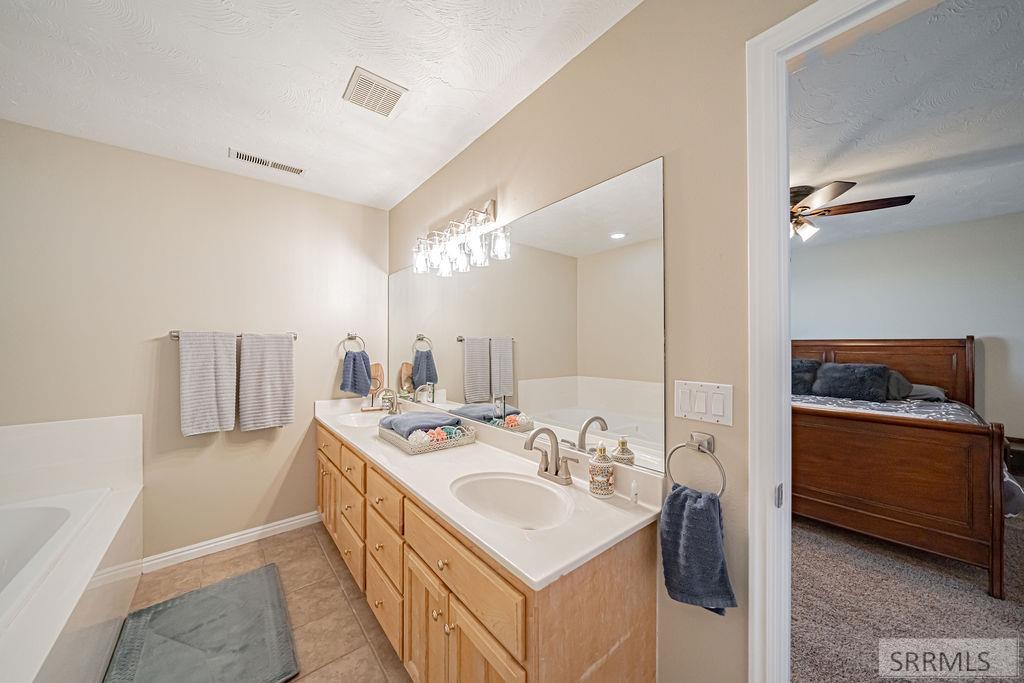 7121 South Culebra Rio Circle Idaho Falls, ID 83406 - Photo 60 of 90 Basement Bathroom with Tub and Shower