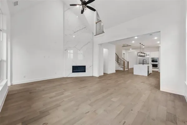 a view of a kitchen with a sink and a large window