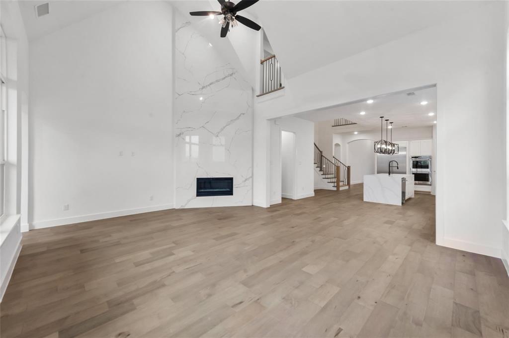 15577 Desert Broom Road Frisco, TX 75035 - Photo 11 of 37 a view of a kitchen with a sink and a large window