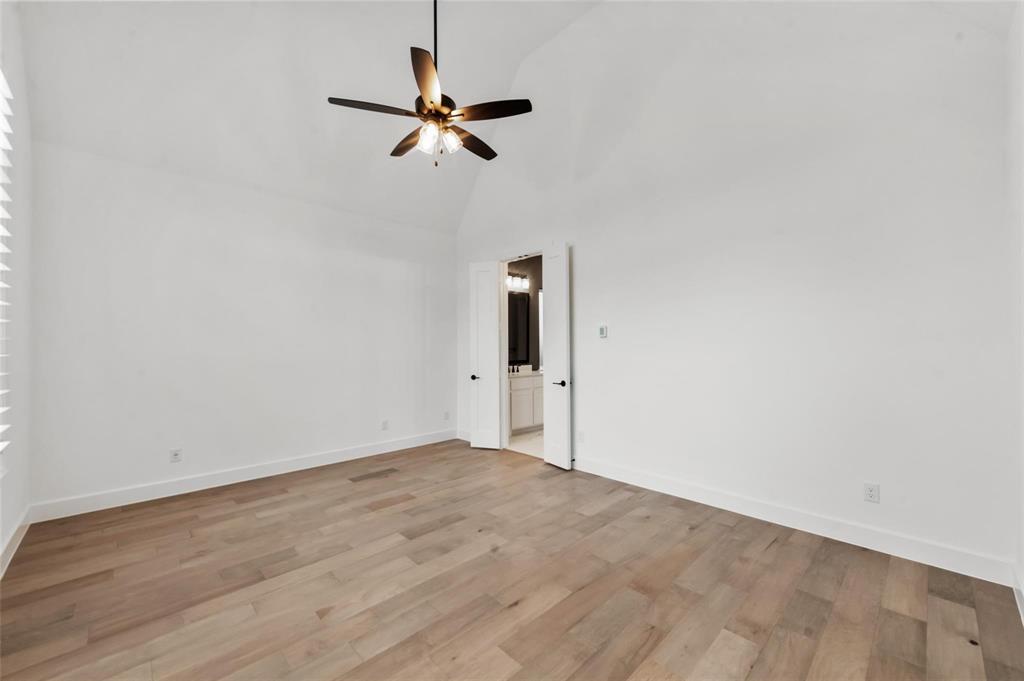15577 Desert Broom Road Frisco, TX 75035 - Photo 13 of 37 a view of room with a ceiling fan and wooden floor