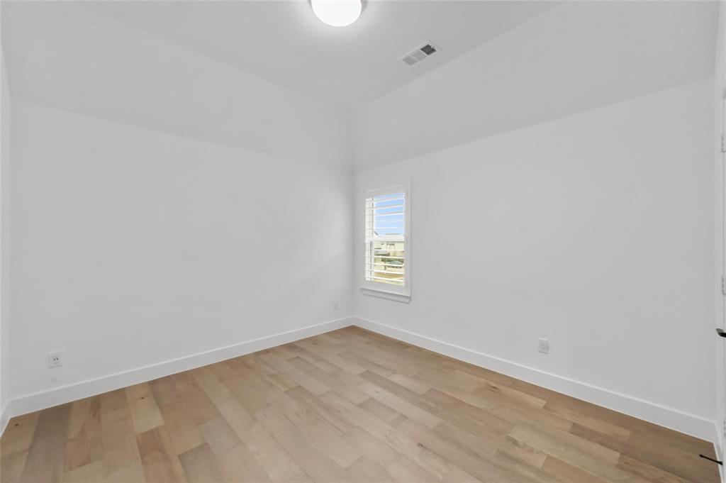 15577 Desert Broom Road Frisco, TX 75035 - Photo 21 of 37 a view of an empty room and window