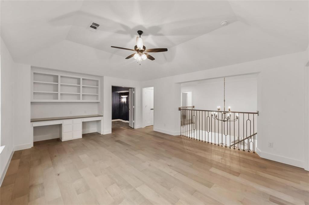 15577 Desert Broom Road Frisco, TX 75035 - Photo 26 of 37 a view of a livingroom with a furniture and chandelier fan