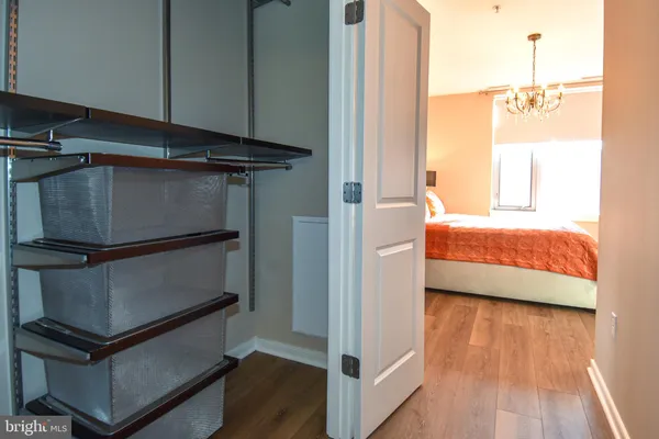 a bedroom with bed and window