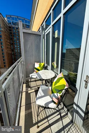 a bathroom with a granite countertop sink toilet mirror and bathtub