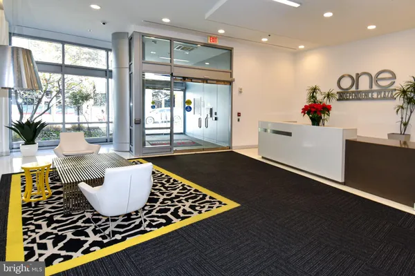 view of living room with furniture and floor to ceiling window