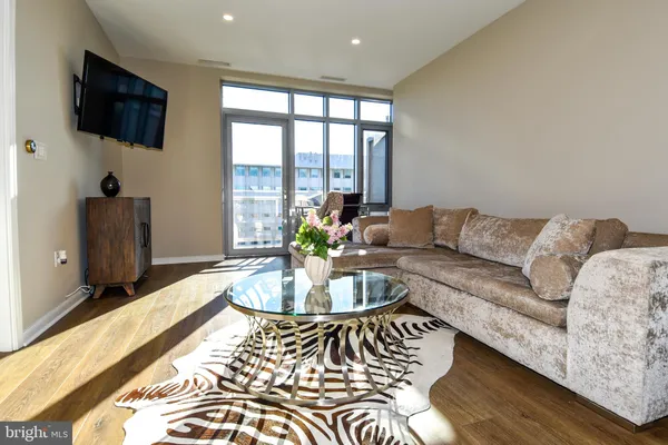 a kitchen with stainless steel appliances granite countertop a refrigerator stove and microwave