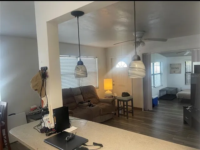 a view of a dining room with furniture and window