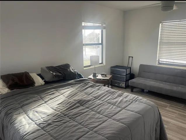 a view of a room with furniture and windows