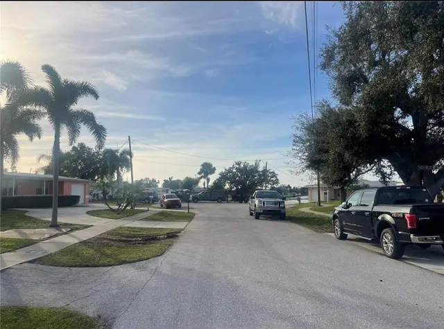 a view of a backyard of the house