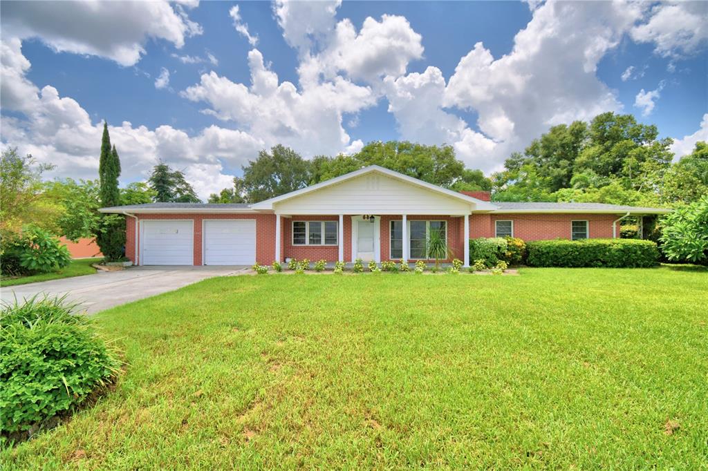 1475 Lake Howard Drive Southwest Winter Haven, FL 33880 - Photo 1 of 25 a view of a house with a yard