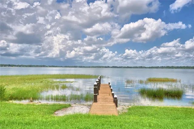 a view of a lake with a big yard