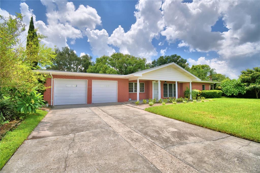 1475 Lake Howard Drive Southwest Winter Haven, FL 33880 - Photo 24 of 25 a front view of house with yard and green space