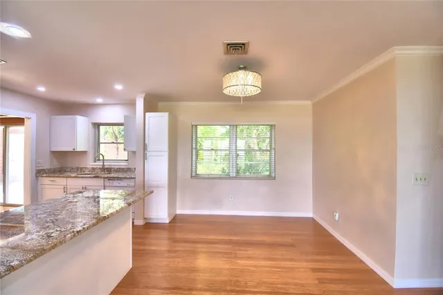 a view of a kitchen and a window