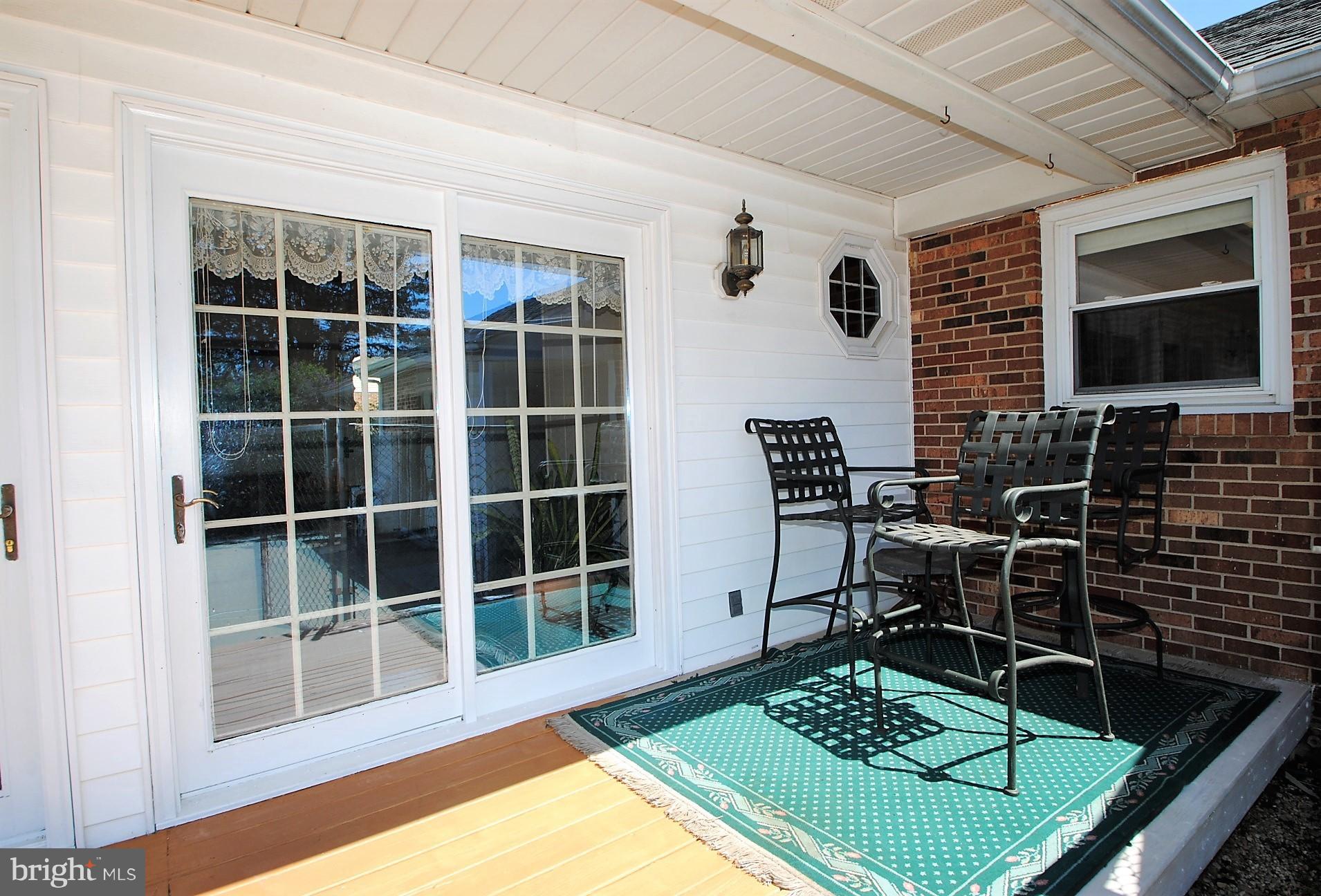 355 Maloney Road Elkton, MD 21921 - Photo 24 of 26 Rear deck between sunroom and pool