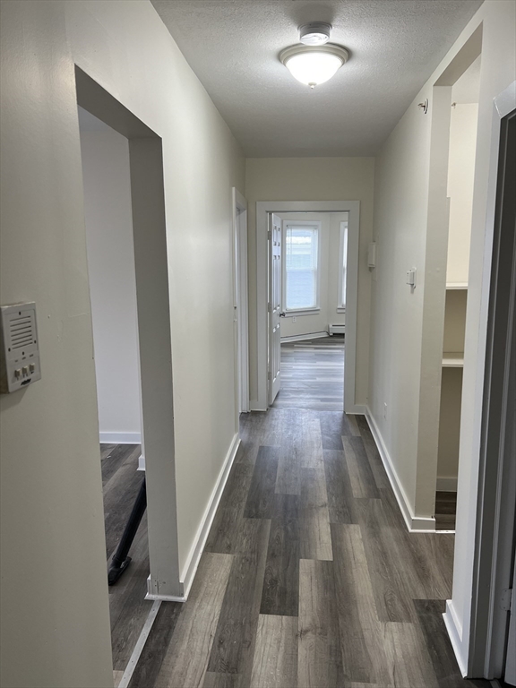 93 Florence Street Springfield, MA 01105 - Photo 6 of 9 a view of a hallway with wooden floor