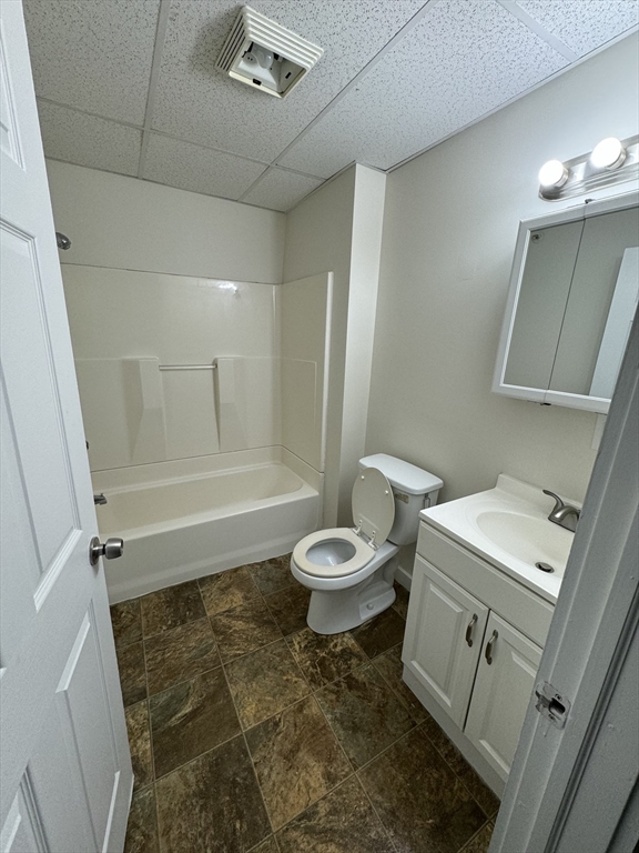 93 Florence Street Springfield, MA 01105 - Photo 7 of 9 a bathroom with a toilet sink and a mirror