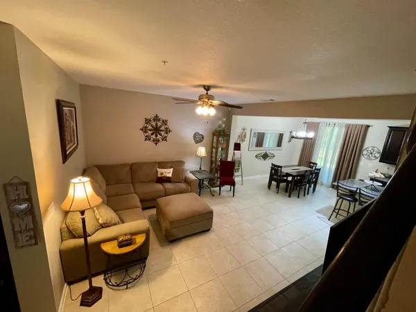 a living room with furniture and white walls
