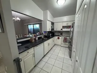 a bathroom with a sink vanity tub and shower