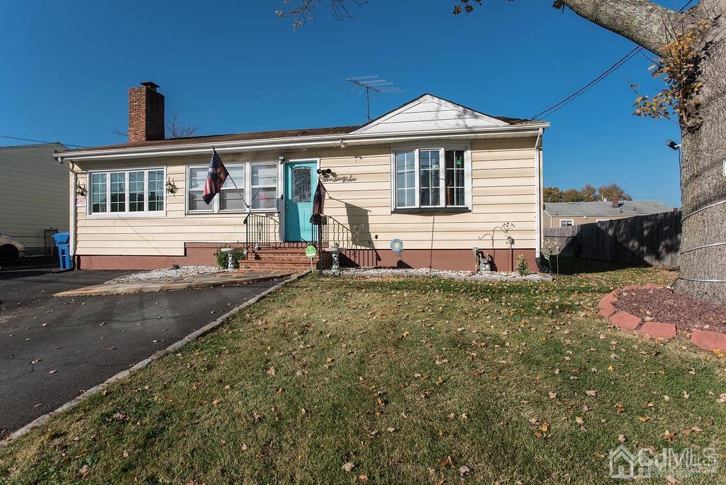 566 New Dover Road Colonia, NJ 07067 - Photo 1 of 23 a front view of a house with a yard