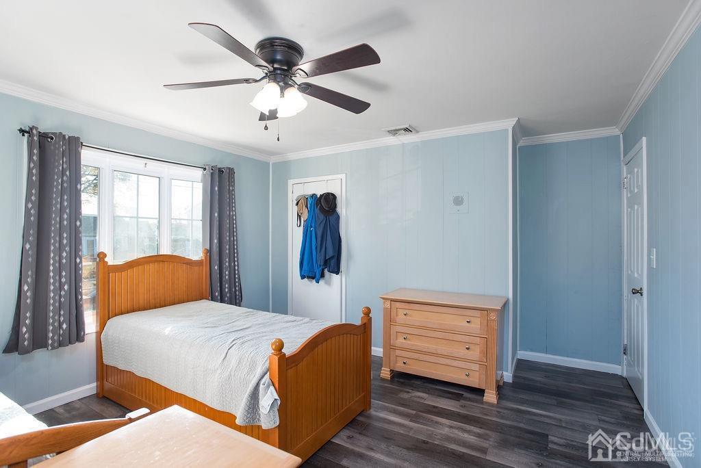 566 New Dover Road Colonia, NJ 07067 - Photo 12 of 23 a bedroom with a bed and wooden floor