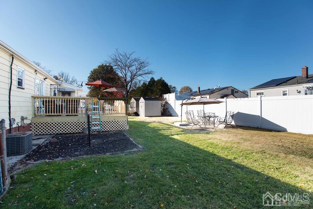 566 New Dover Road Colonia, NJ 07067 - Photo 19 of 23 a view of a backyard with a garden and entertaining space