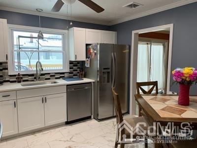 566 New Dover Road Colonia, NJ 07067 - Photo 3 of 23 a kitchen with stainless steel appliances granite countertop a refrigerator and a sink