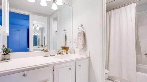 a bedroom with a large bed and a large window