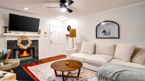 a living room with furniture and a flat screen tv