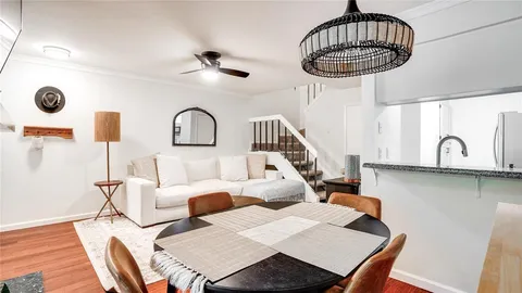 a bedroom with furniture and a chandelier