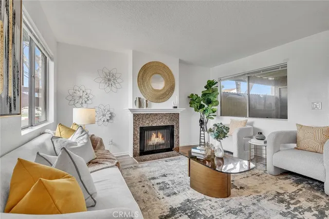 a living room with furniture and a fireplace