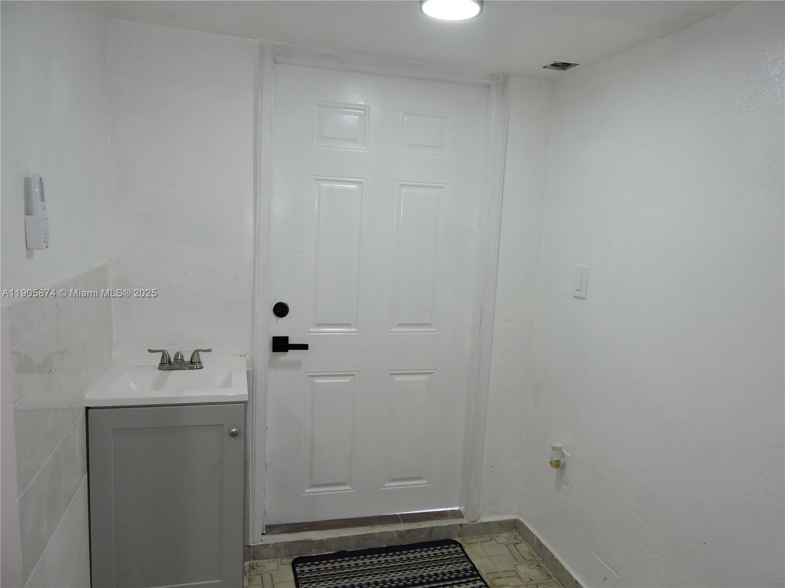 5451 West 10th Avenue, Unit 5 Hialeah, FL 33012 - Photo 11 of 26 a bathroom with a sink