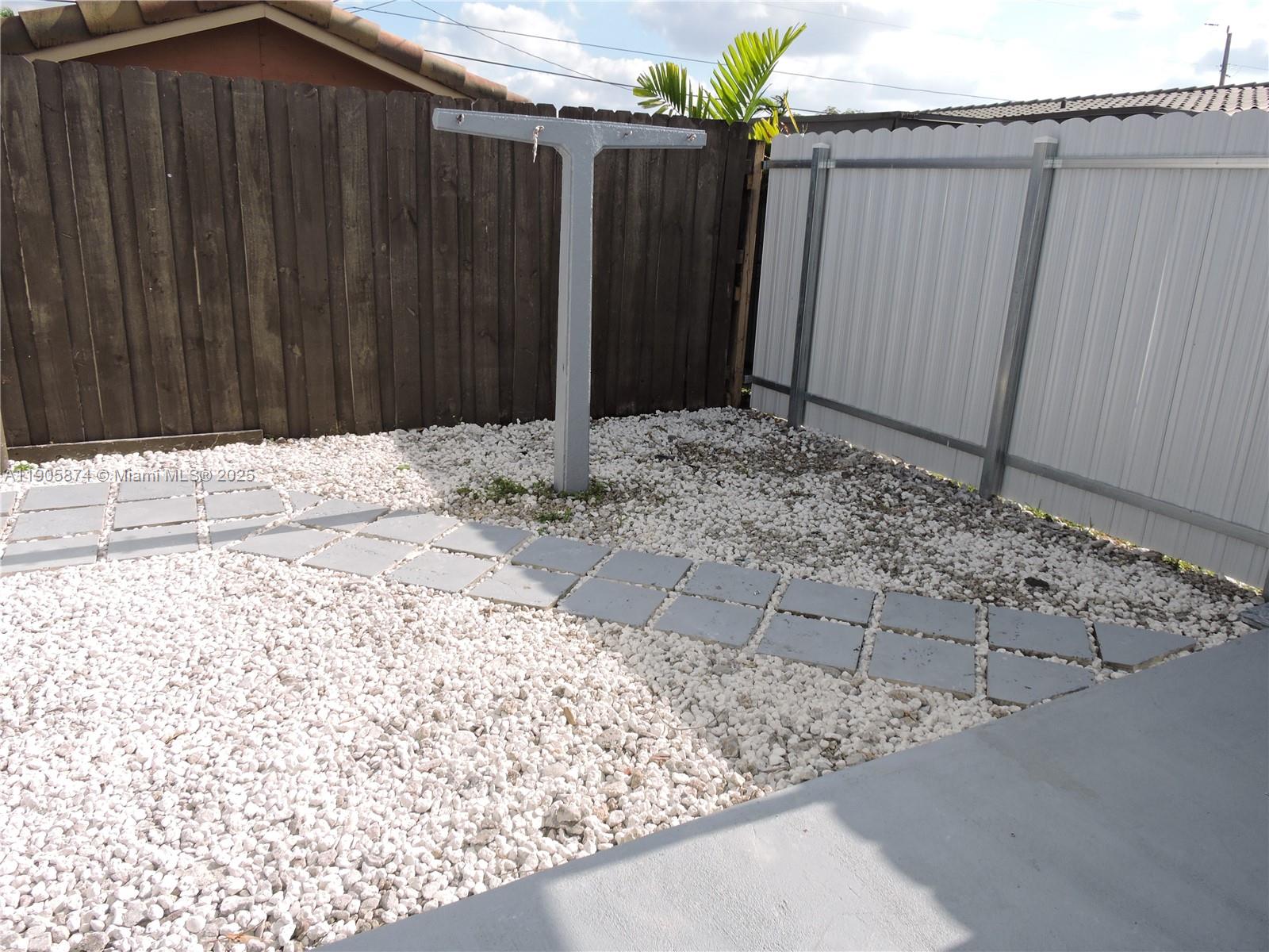 5451 West 10th Avenue, Unit 5 Hialeah, FL 33012 - Photo 2 of 26 a backyard of a house