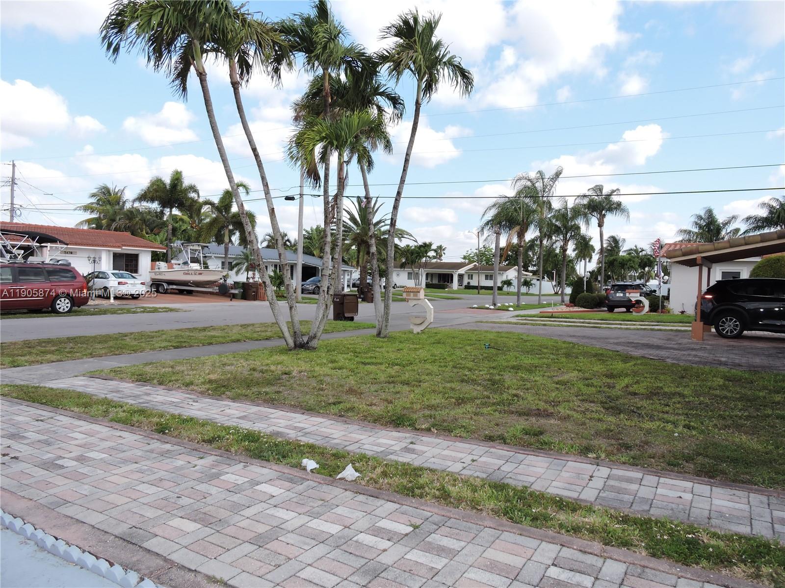 5451 West 10th Avenue, Unit 5 Hialeah, FL 33012 - Photo 25 of 26 a view of a park with swings and slides