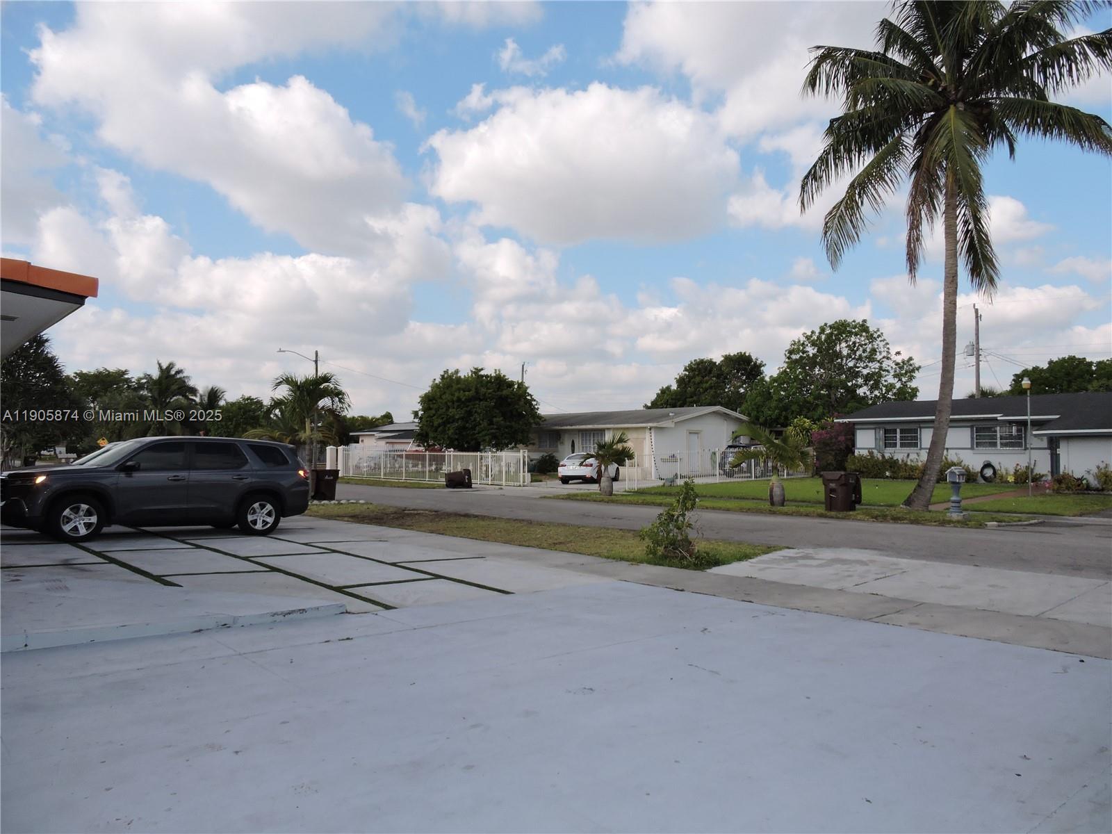 5451 West 10th Avenue, Unit 5 Hialeah, FL 33012 - Photo 26 of 26 a view of a street with a car parked on the road