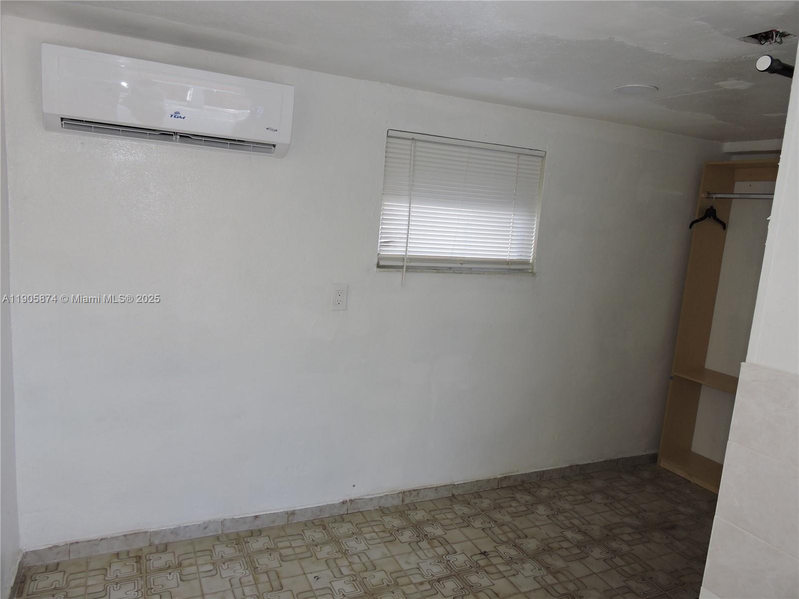 5451 West 10th Avenue, Unit 5 Hialeah, FL 33012 - Photo 4 of 26 a view of a small space with window