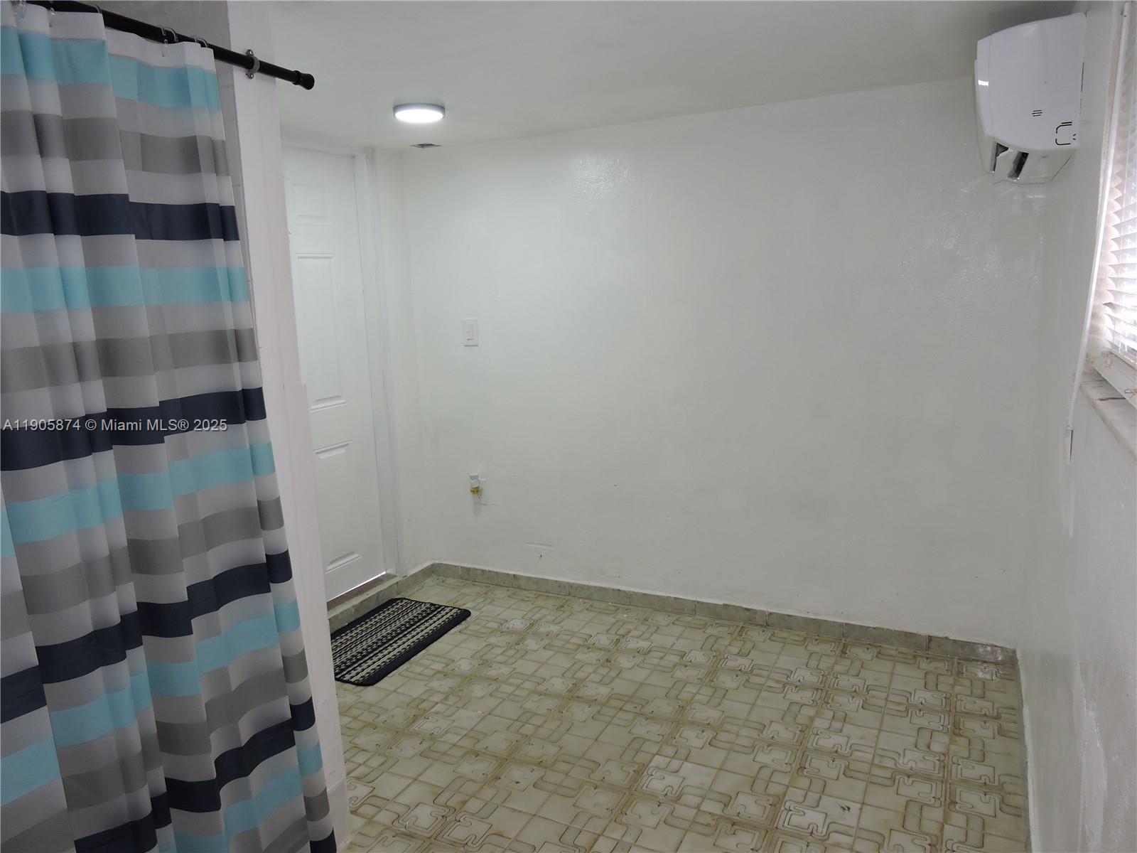 5451 West 10th Avenue, Unit 5 Hialeah, FL 33012 - Photo 7 of 26 a bathroom with a shower