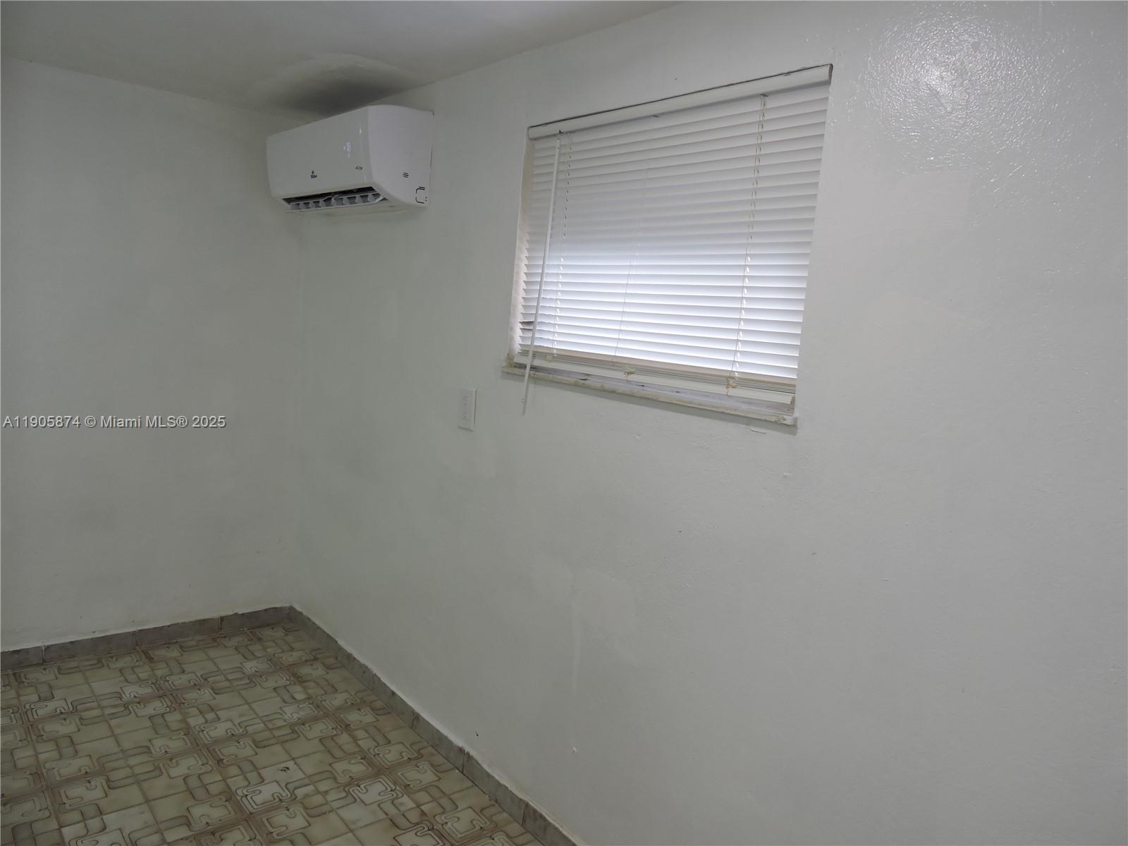 5451 West 10th Avenue, Unit 5 Hialeah, FL 33012 - Photo 10 of 26 a view of a small space with a window