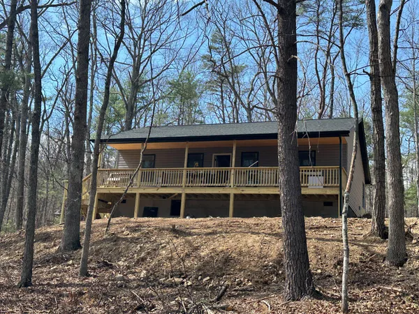 a view of a house with a snow on the road