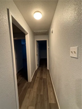a bathroom with a shower sink and mirror