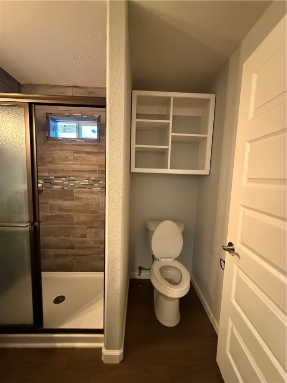 917 Corazan Street Alice, TX 78332 - Photo 25 of 37 a bathroom with a toilet and a shower