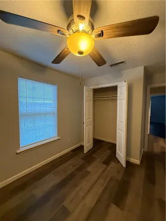 a bathroom with a double vanity sink toilet and a mirror