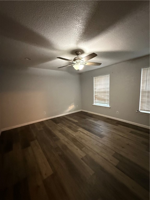 917 Corazan Street Alice, TX 78332 - Photo 32 of 37 an empty room with wooden floor fan and windows